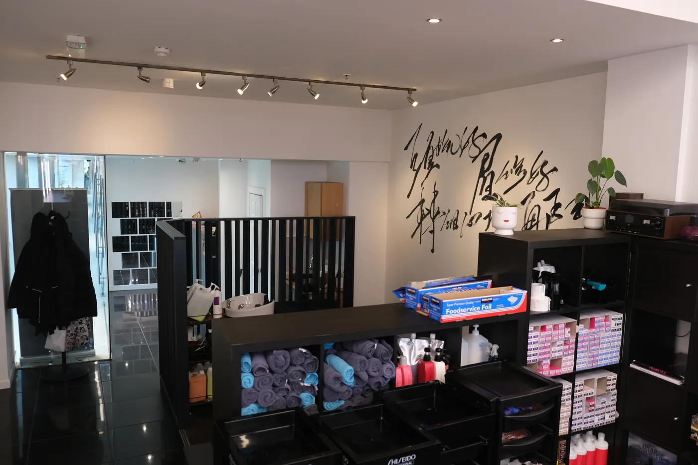 Reception and retail area with calligraphy wall art